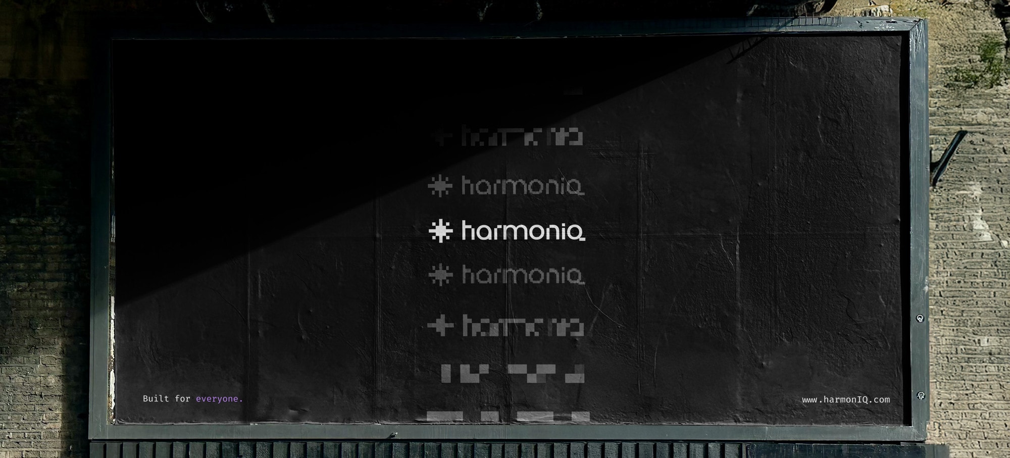A black HarmonIQ billboard, the wordmark repeated down it.
